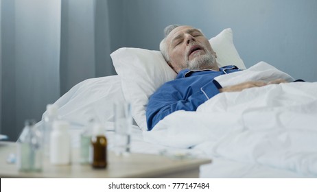 old-man-sleeping-bed-hospital-260nw-777147484.jpg