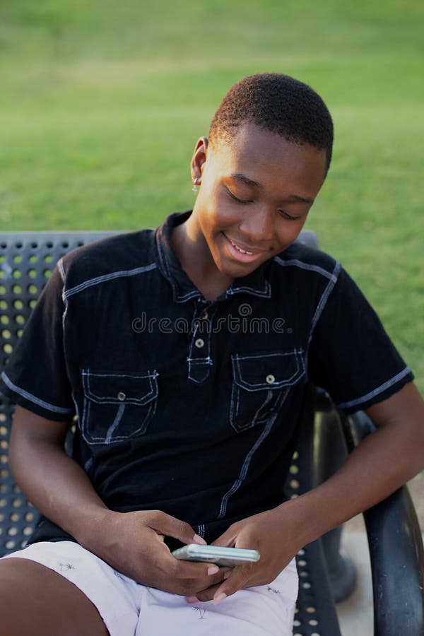 happy-head-shot-portrait-african-american-teen-boy-outside-spending-time-his-smart-phone-happy-black-teen-boy-using-his-192130578.jpg