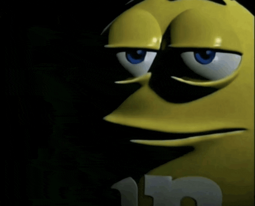 a close up of a yellow m & m 's character