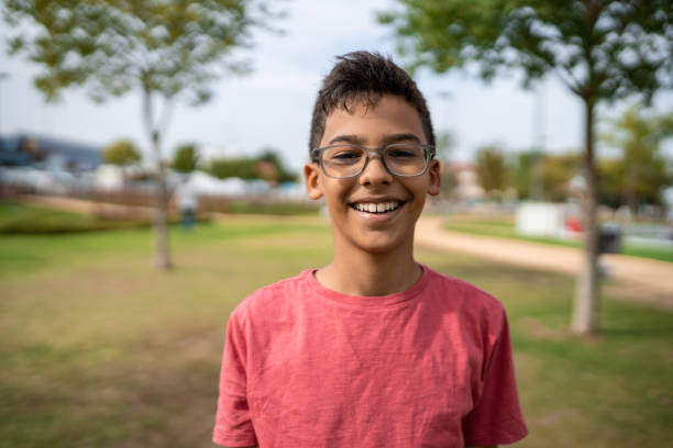 portrait-of-boy-laughing-in-public-square.jpg