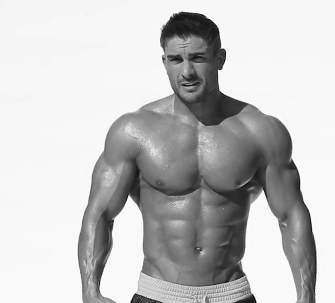 Model flexing his muscles | MATTHEW'S ISLAND