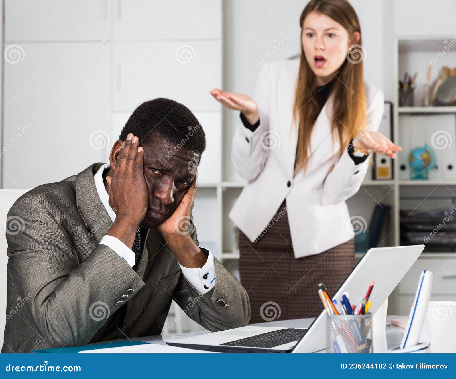 upset-man-angry-boss-frustrated-sitting-office-desk-disgruntled-female-behind-236244182.jpg