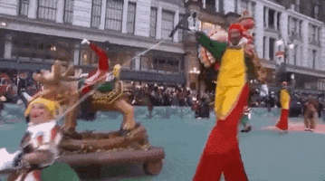 macys parade stilts GIF by The 92nd Annual Macy’s Thanksgiving Day Parade