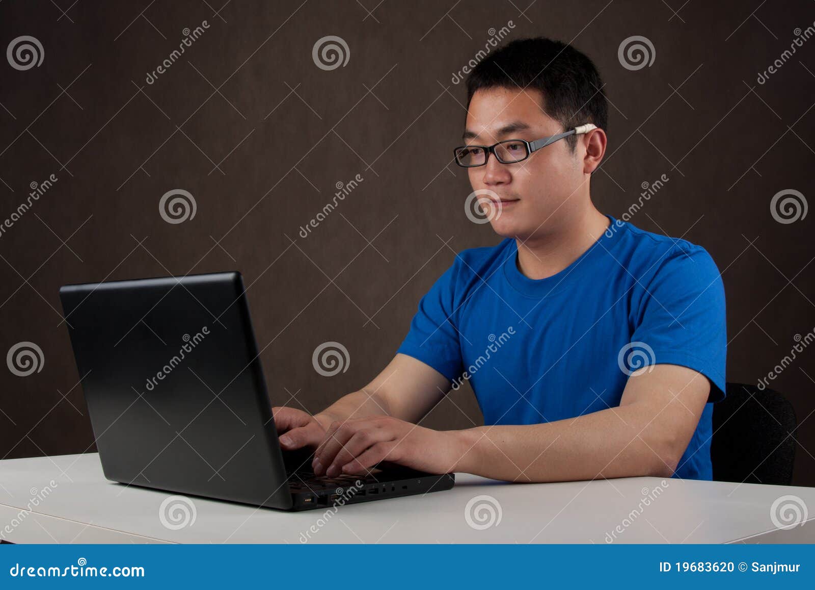 young-asian-man-working-his-laptop-computer-19683620.jpg