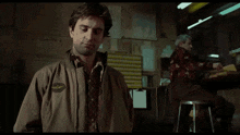 a man in a jacket and tie says  anytime anywhere 