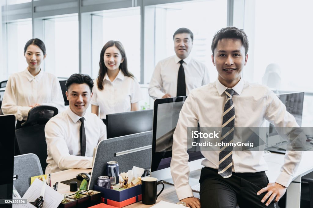 team-photo-of-smiling-chinese-business-people.jpg