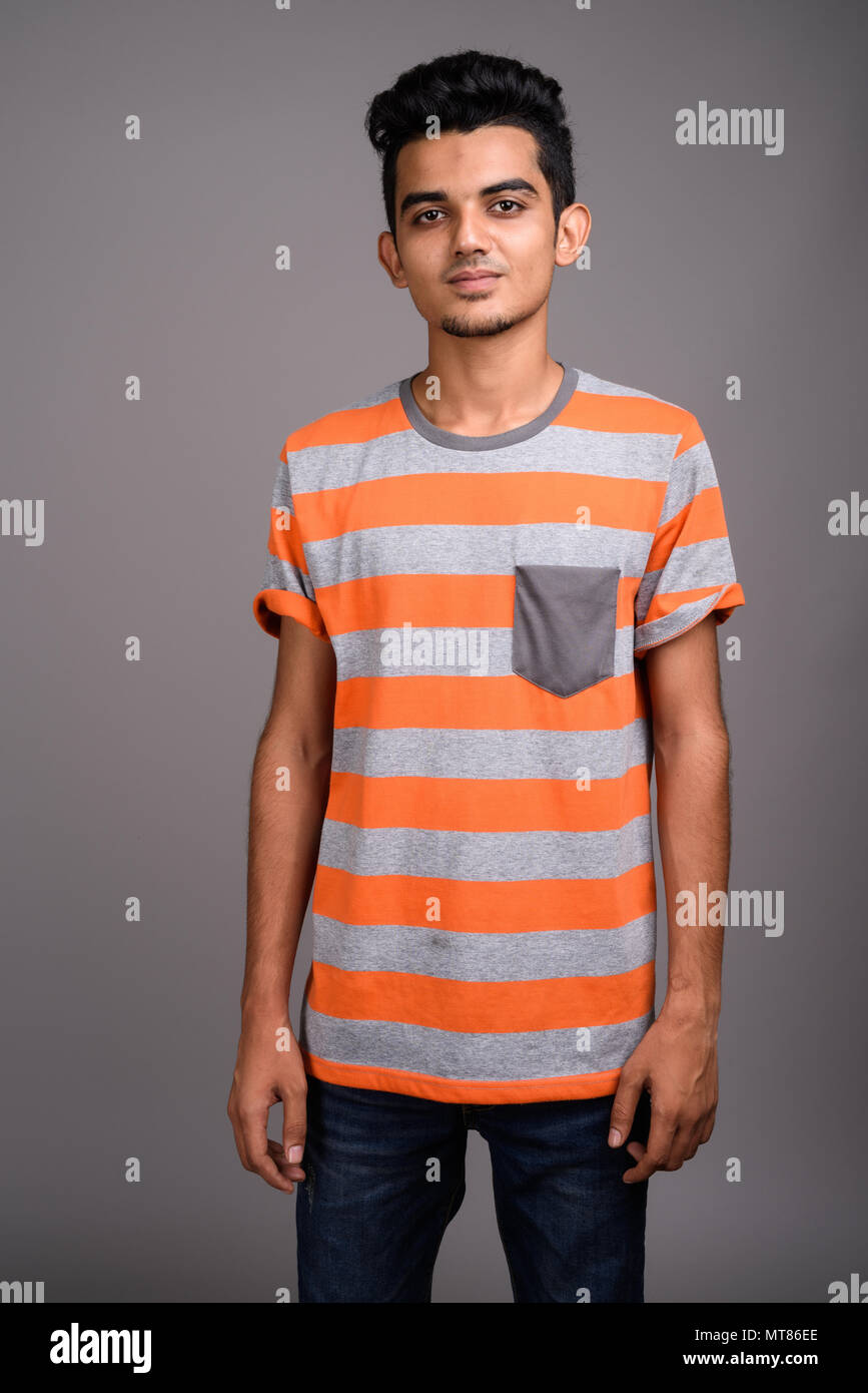 young-indian-man-against-gray-background-MT86EE.jpg