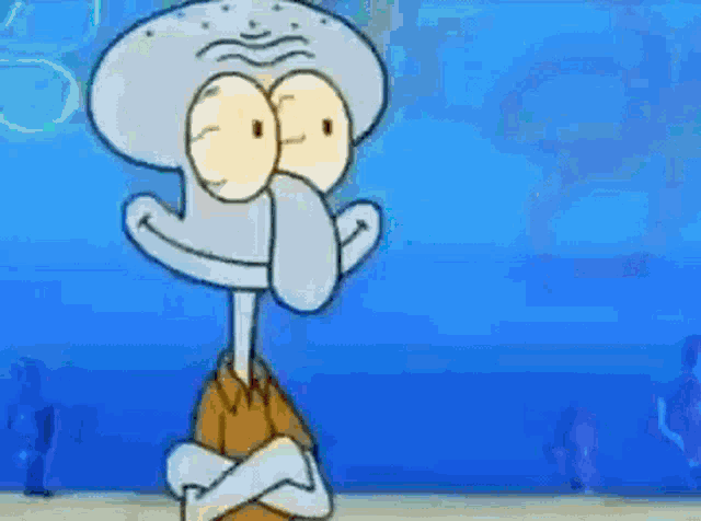 squidward from spongebob squarepants is standing with his arms crossed and looking at the camera .