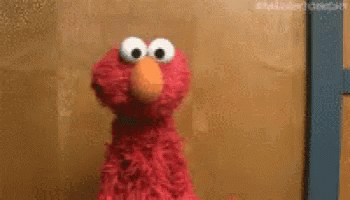 Elmo Idk GIF - Elmo Idk Shrug GIFs