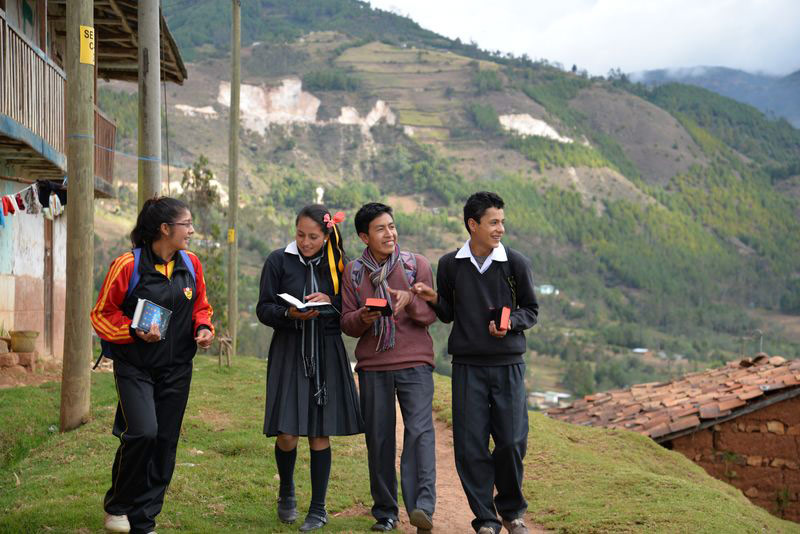 peru-teens-walkreading.jpg