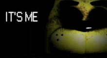 a close up of a yellow stuffed animal with the words `` it 's me '' written on it .