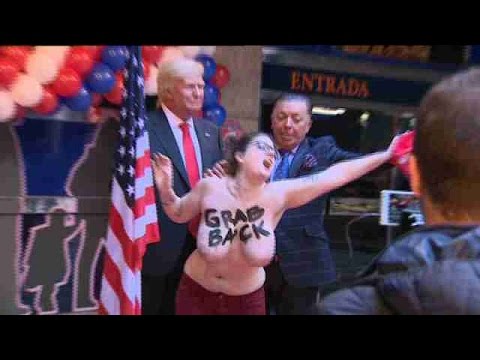 Feminist activist flashes breasts as protest against Trump in Madrid -  YouTube