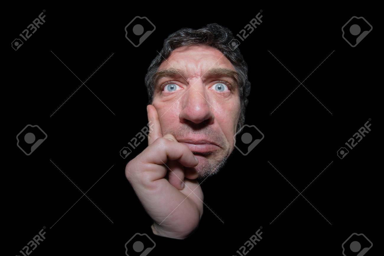 50899860-ugly-and-thoughtful-man-with-big-blue-eyes-and-hand-on-chin-isolated-on-black-background.jpg