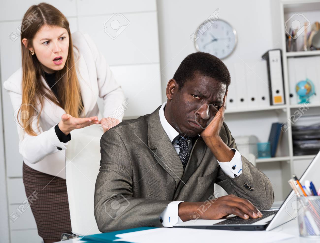 121793464-angry-female-boss-screaming-to-young-male-manager-during-working-in-office.jpg