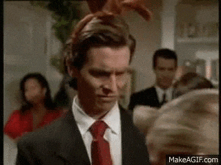 a man in a suit and tie with bunny ears on his head