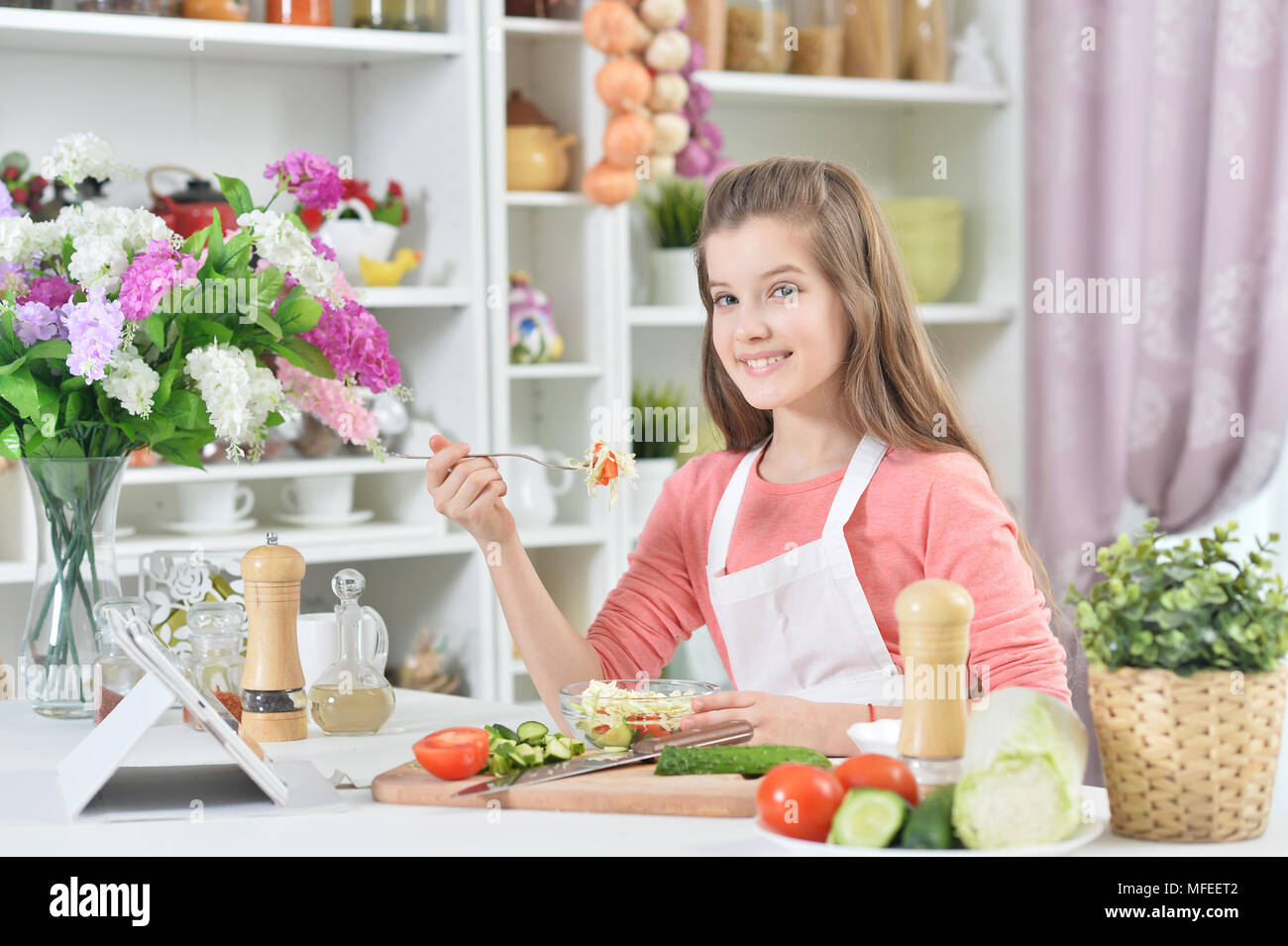 attractive-young-girl-cooking-MFEET2.jpg