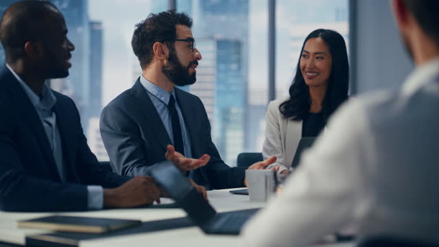 modern-multi-ethnic-office-conference-room-meeting-diverse-team-of-top-managers-talk.jpg