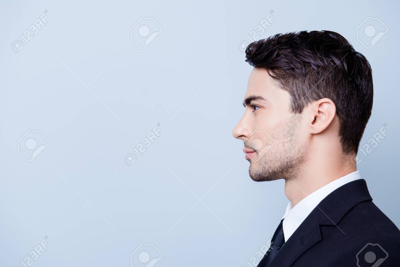 84622769-side-profile-photo-of-a-young-handsome-brunete-realtor-with-bristle-in-a-formal-wear-standing-on-the.jpg