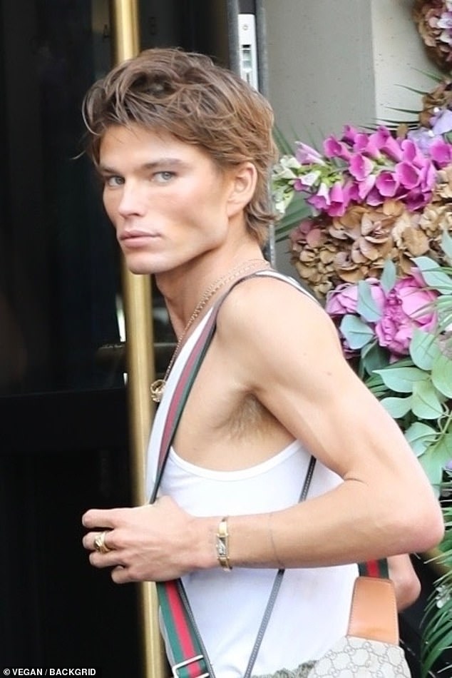 Supermodel Jordan Barrett wears a white vest and Gucci bag as he arrives at  star-studded Vogue World | Daily Mail Online