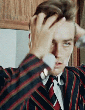 delon-fix-hair.gif