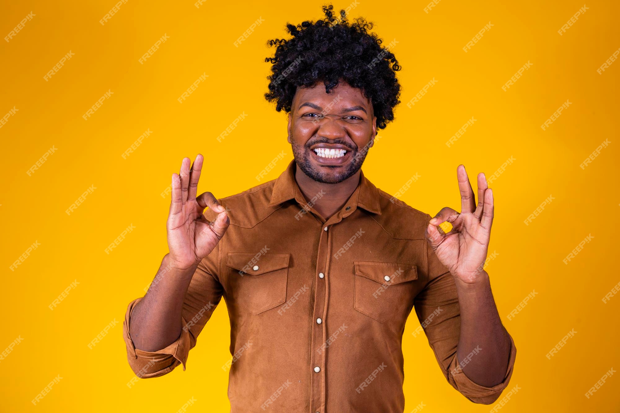 portrait-happy-black-man-showing-ok-sign-smiling-yellow-background_432566-11310.jpg