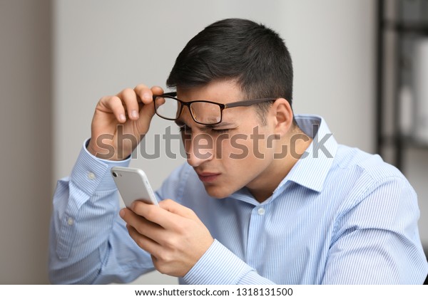 young-man-bad-sight-trying-600w-1318131500.jpg