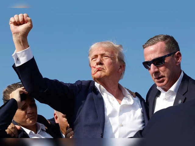 republican-presidential-candidate-former-president-donald-trump-pumps-his-fist-as-he-is-rushed-offstage-during-a-rally-on-july-13-2024-in-butler-pennsylvania-.jpg