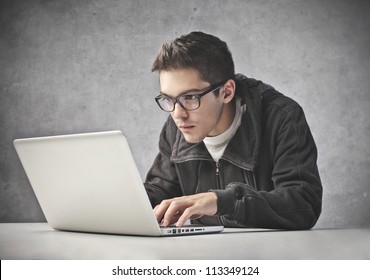 boy-using-his-laptop-computer-260nw-113349124.jpg