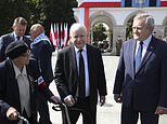 Poland's main ruling party leader Jaroslaw Kaczynski, center, attends a wreath laying ceremony marking national observances of the anniversary of World War II in Warsaw, Poland, Sept. 1, 2022. World War II began on Sept. 1, 1939, with Nazi Germany's bombing and invading Poland, for more than five years of brutal occupation. (AP Photo/Michal Dyjuk)