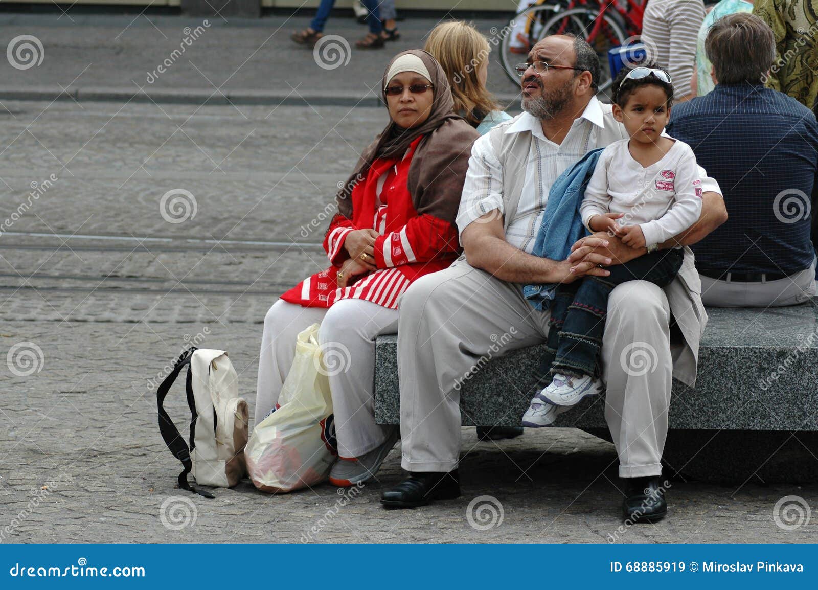 muslim-family-resting-street-amsterdam-holland-september-68885919.jpg