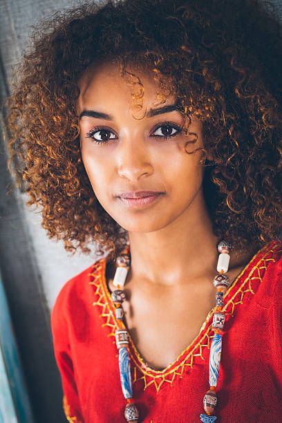 Beautiful Ethiopian woman with curly hair in traditional clothing