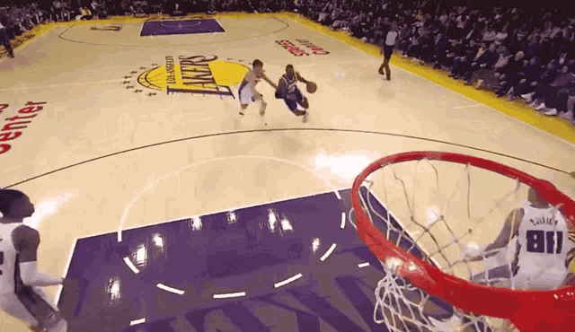 a basketball game is being played on a court that says lakers