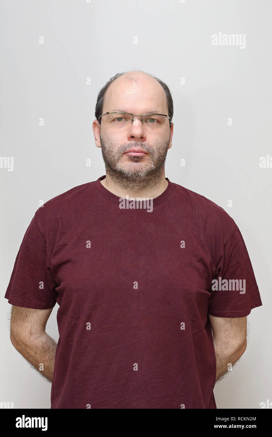 middle-age-bald-man-with-beard-and-eyeglasses-RCKN2M.jpg