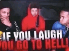 a group of men are standing in front of a sign that says  if you laugh you go to hell 