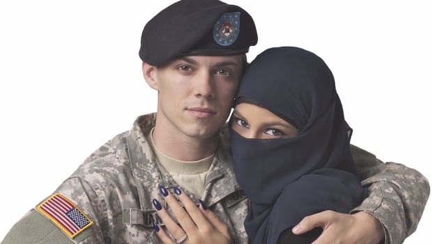 Ad Agency Rejects 'Uncomfortable' Photo of Muslim Woman Embracing a US  Soldier from Its Times Square Billboards