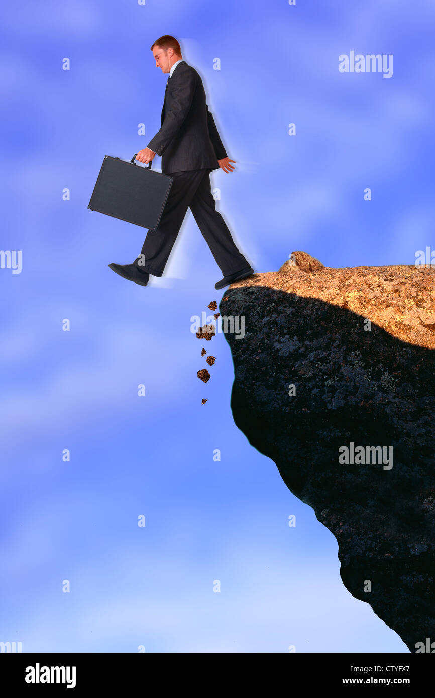 businessman-walking-off-rocky-cliff-CTYFX7.jpg