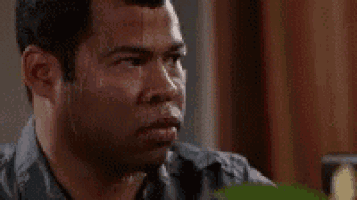 a man is sweating profusely and looking at the camera .