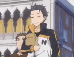 a man in a jacket with the letter n on it is standing next to a boy .