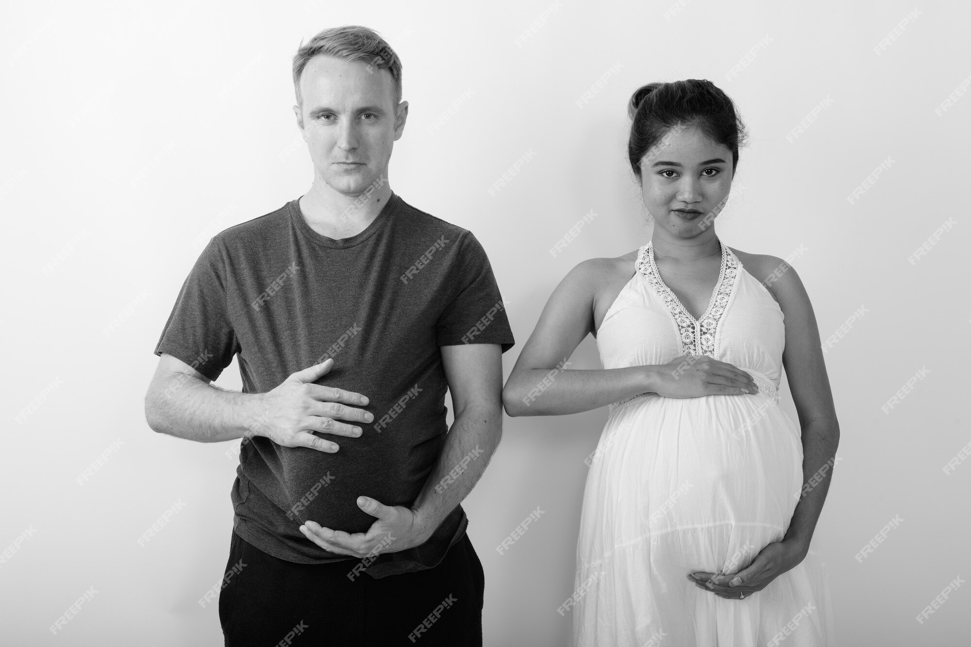man-with-watermelon-as-stomach-pregnant-asian-woman-together-as-multi-ethnic-married-couple-black-white_251136-79737.jpg