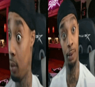 a man is making a funny face while wearing a headband and a white shirt .