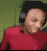 a blurry picture of a person wearing headphones .