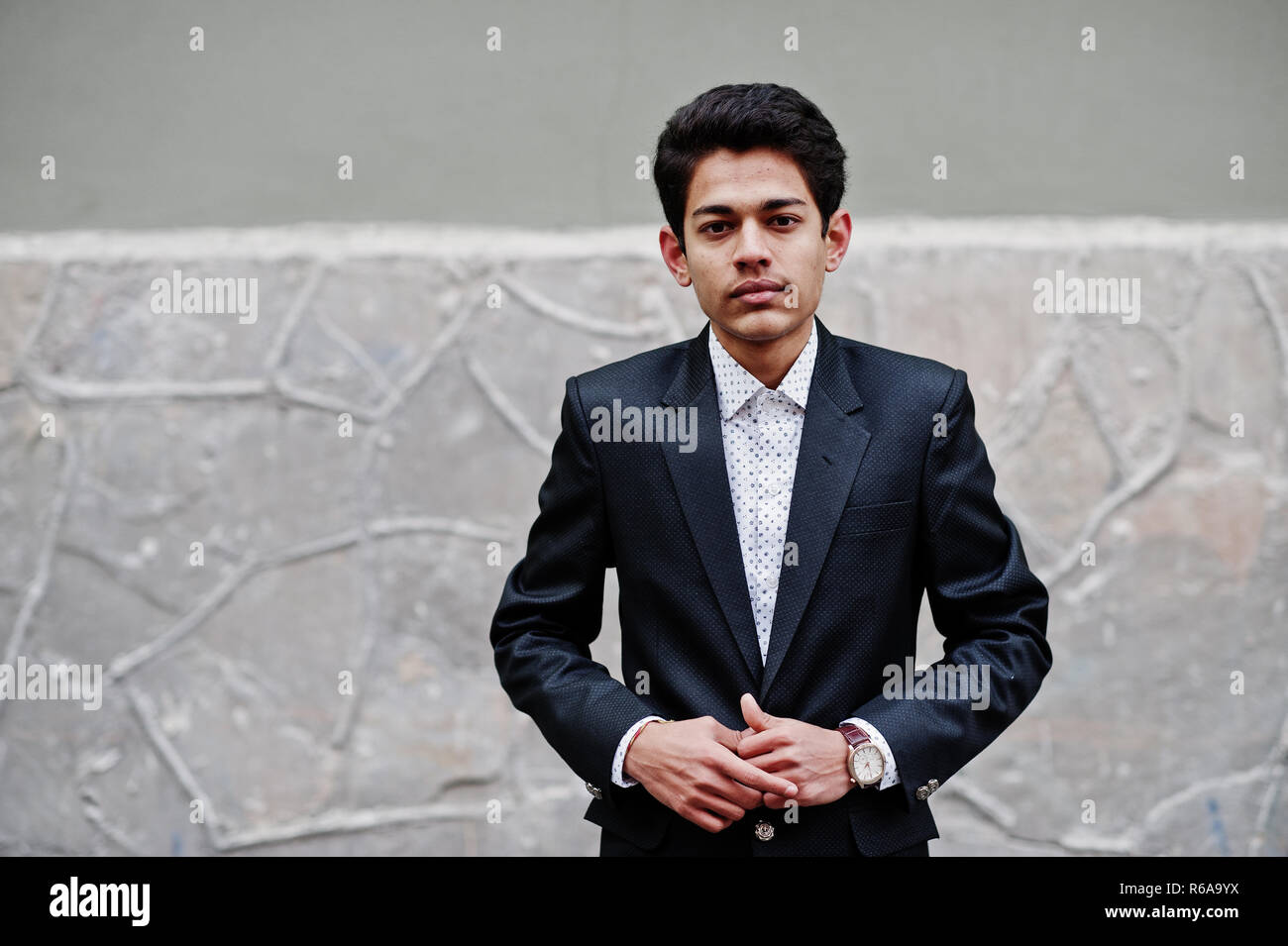 young-indian-man-on-suit-posed-outdoor-R6A9YX.jpg