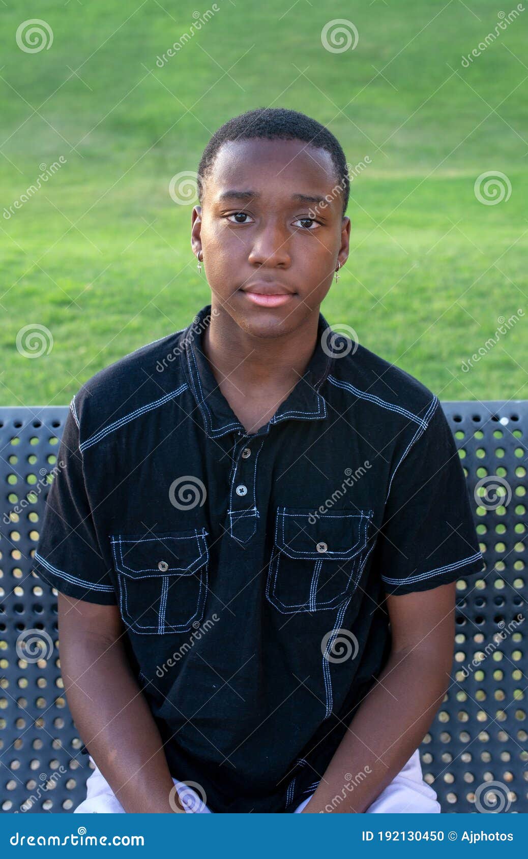 black-teen-boy-looks-serious-solemn-head-shot-portrait-african-american-outside-192130450.jpg