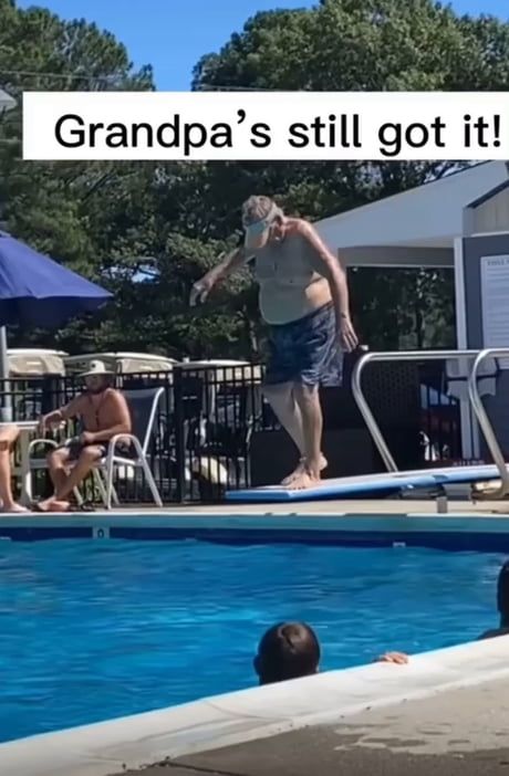 This may contain: a man standing on top of a swimming pool