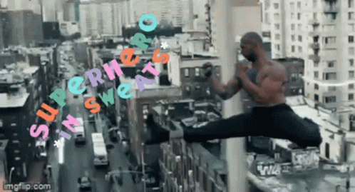 a man is jumping in the air with the words  superhero in sweats  above him