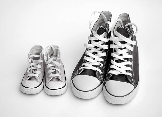 isolated-black-and-white-images-of-adult-and-child-sneakers.jpg