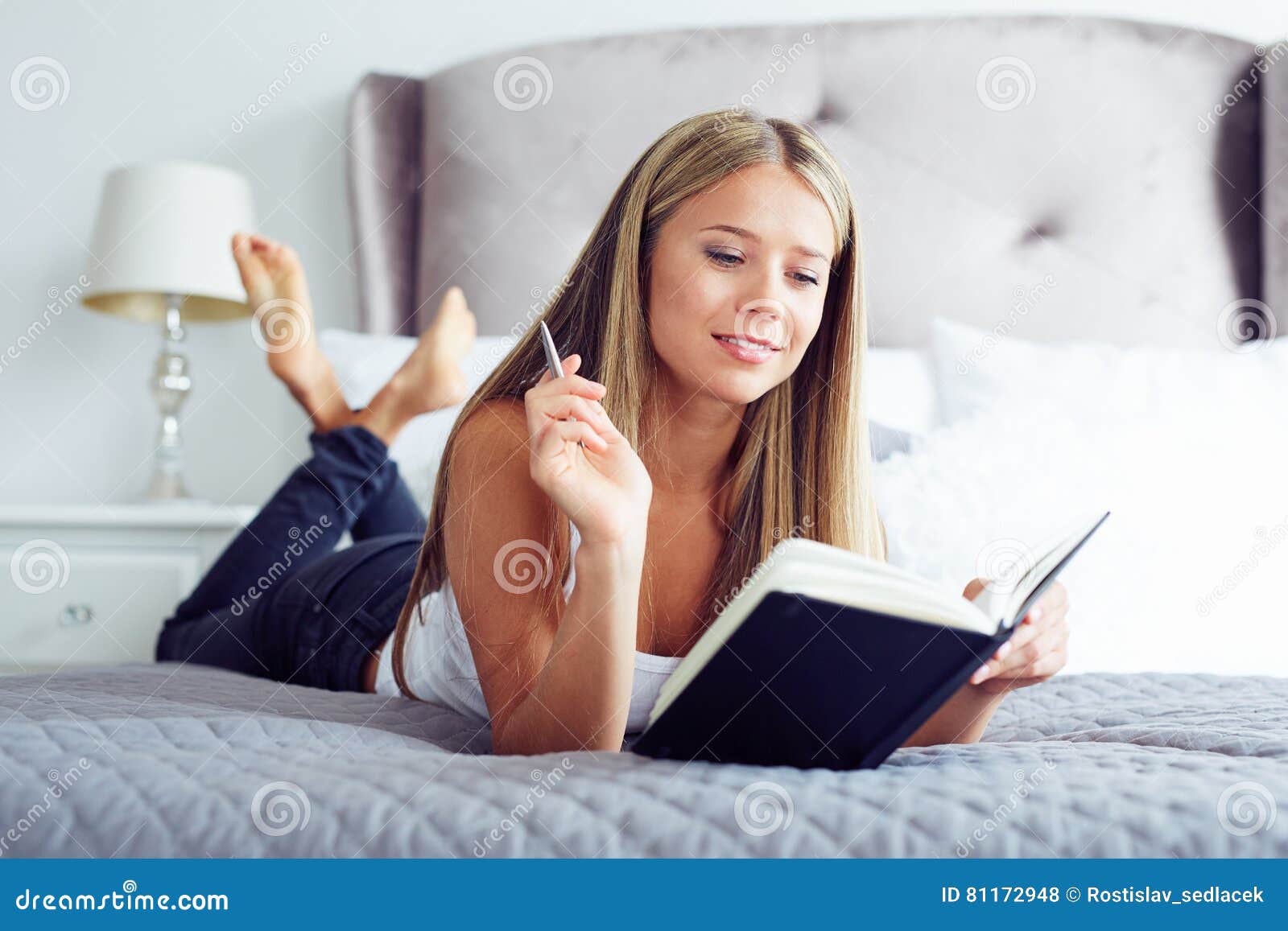 woman-lying-bed-writing-diary-smiling-beautiful-girl-81172948.jpg