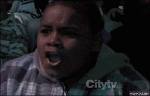 a young boy is making a funny face in front of a crowd and the words citytv are on the bottom right