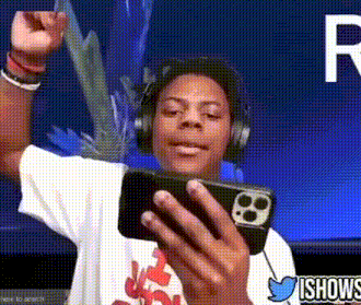 a young man wearing headphones is holding a cell phone in his hand ..