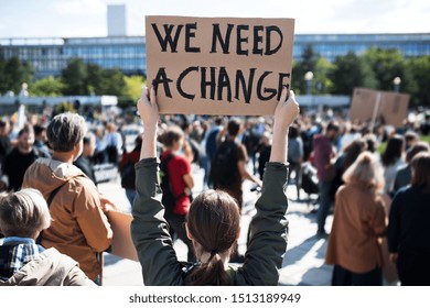 rear-view-people-placards-posters-260nw-1513189949.jpg
